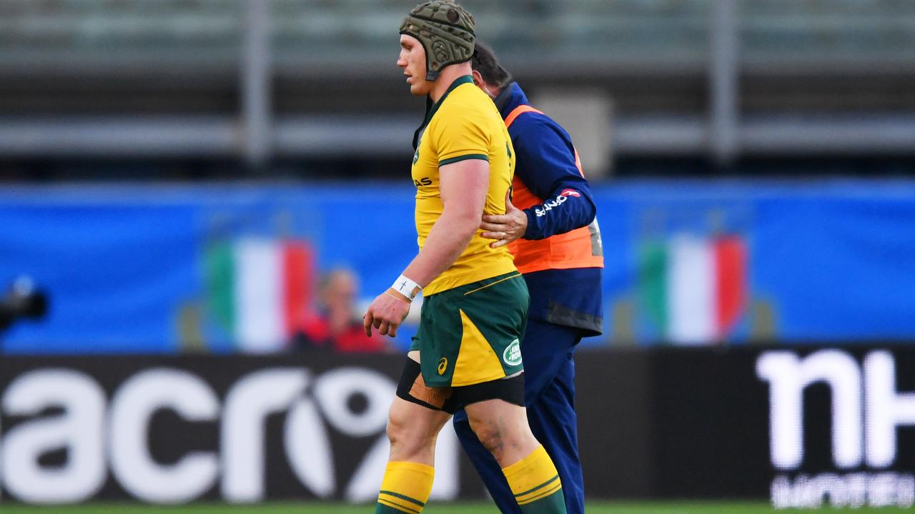 An injured David Pocock of Australia leaves the pitch at Stadio Euganeo.