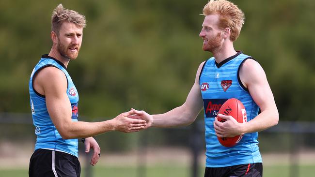 Essendon skipper Dyson Heppell with Aaron Francis. Picture: Michael Klein