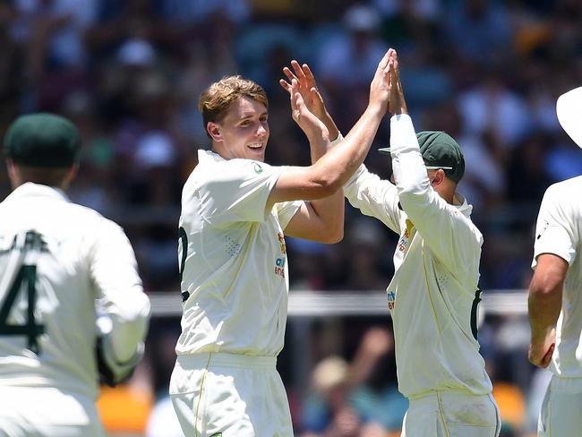 Cameron Green of Australia celebrates taking the wicket of Chris Woakes of England during day four of the first Ashes cricket Test match between England and Australia at the Gabba in Brisbane on December 11, 2021. (Photo by Dan PELED / AFP) / -- IMAGE RESTRICTED TO EDITORIAL USE - STRICTLY NO COMMERCIAL USE --