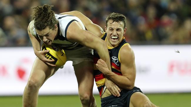 Adelaide’s Tom Doedee tries to slow down Geelong’s Wylie Buzza. Picture: Sarah Reed