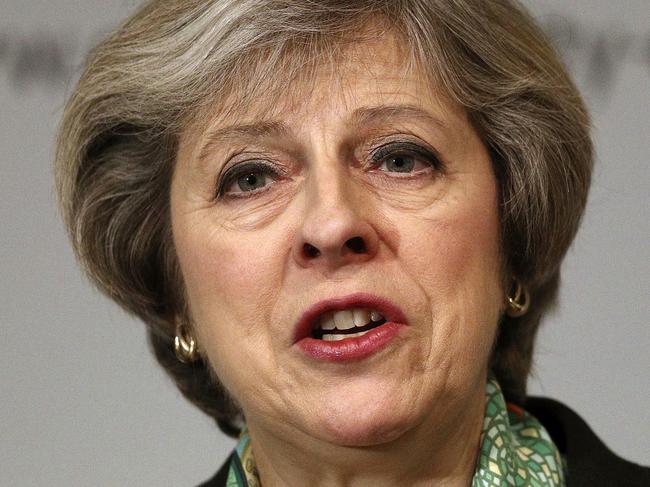 Britain's Prime Minister Theresa May speaks to members of the Charity Commission for England and Wales at The Royal Society in London, where she detailed plans to provide greater support for those suffering mental health problems, Monday Jan. 9, 2017. (Dan Kitwood/Pool via AP)