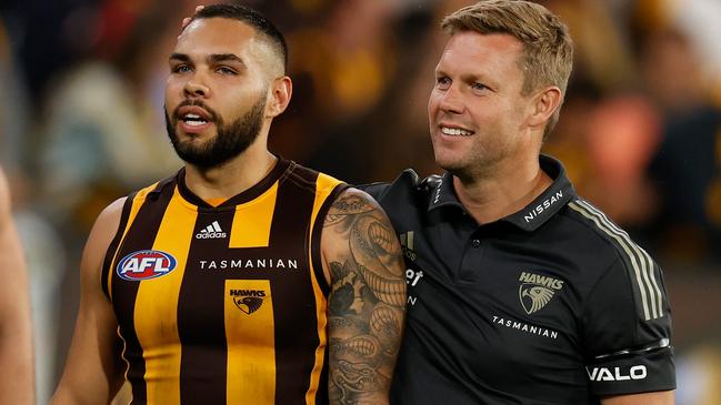 Jarman Impey with coach Sam Mitchell after their upset win against Geelong. Picture: AFL Photos via Getty Images