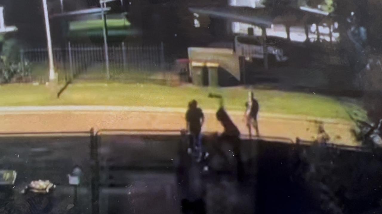 CCTV Footage shows a youth scaling a residential fence line, trying to attack a resident on the other side. Picture: Supplied.