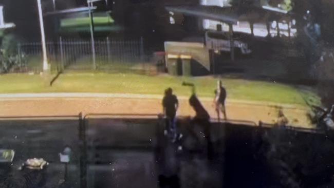 CCTV Footage shows a youth scaling a residential fence line, trying to attack a resident on the other side. Picture: Supplied.