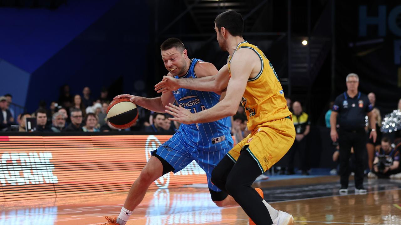 PERTH, AUSTRALIA - SEPTEMBER 19: Matthew Dellavedova of Melbourne United looks controls the ball under pressure from Fabijan Krslovic of the JackJumpers during the round one NBL match between Melbourne United and Tasmania Jackjumpers at RAC Arena, on September 19, 2024, in Perth, Australia. (Photo by Will Russell/Getty Images)