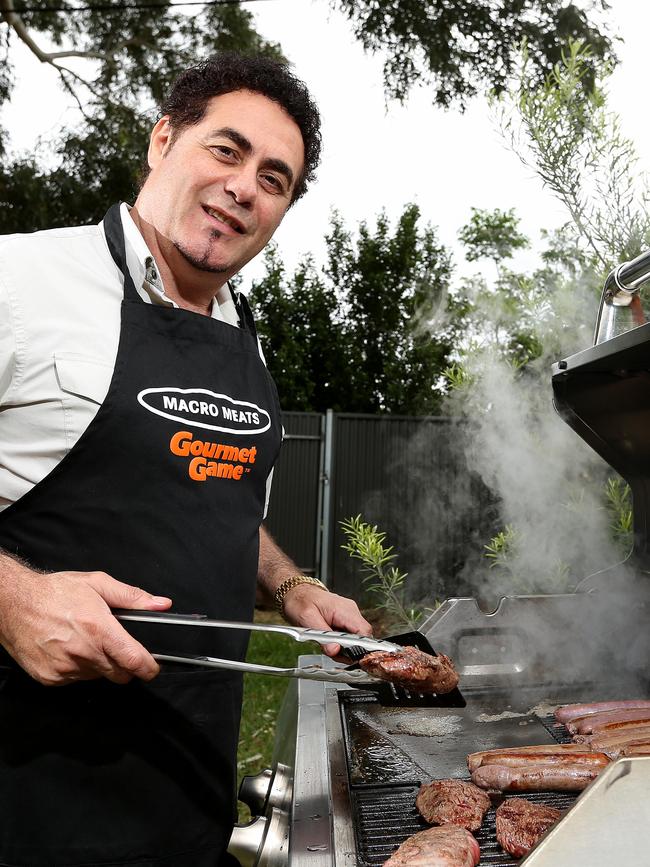 Ray Borda cooking up a kangaroo barbecue. Picture: Simon Cross