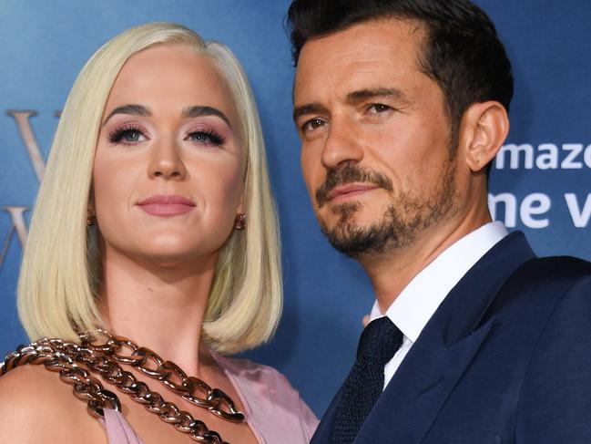 (FILES) In this file photo British actor Orlando Bloom and US singer/songwriter Katy Perry arrive for the Los Angeles premiere of Amazon Original Series "Carnival Row" at the TCL Chinese theatre on August 21, 2019 in Hollywood. - It was a twofer for fans of Katy Perry: the pop star confirmed that she and partner Orlando Bloom are expecting a baby, revealing the surprise as she dropped her latest music video.The new single "Never Worn White" sees Perry, 35, cradling a baby bump in the final seconds of the video, released late March 4, 2020. Shortly before it dropped Perry had published an extract of the clip which had fueled speculation on social media that she might be expecting."Let's just say it's gonna be a jam packed summer..." Perry wrote afterwards on her various social media channels."So glad I don't have to suck it in anymore... or carry a big purse," she told her 108 million Twitter followers. (Photo by VALERIE MACON / AFP)