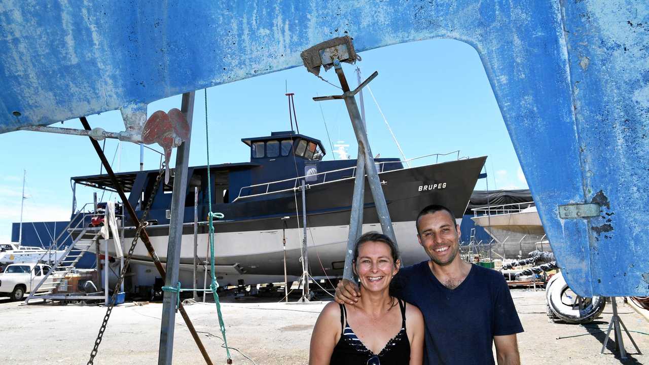 POLAR EXPRESS: Jess and Damien Ashdown with their boat Brupeg, which was salvaged from. Picture: Mike Knott BUN281217BRUPEG3