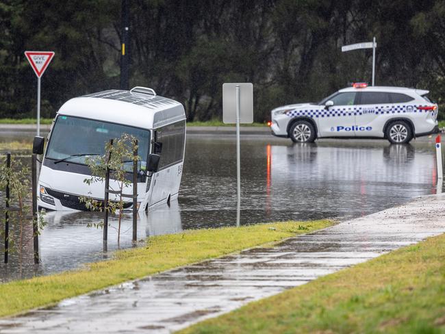 Police attended the scene where the bus became stuck. Picture: Jake Nowakowski