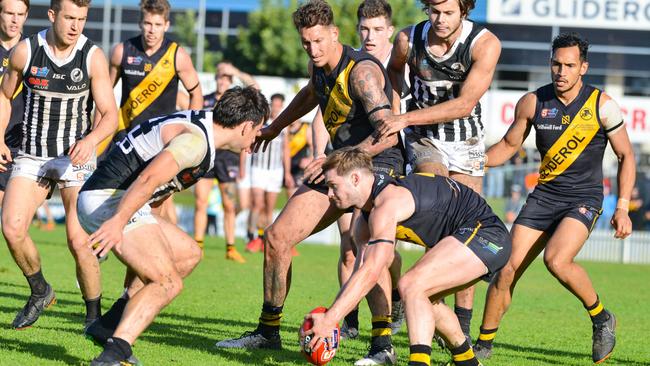 Jonty Scharenberg gets his hands on the ball for Glenelg against Port Adelaide. Picture: AAP/Brenton Edwards