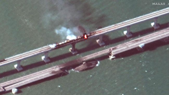 Smoke billowing from a fire on the Kerch Bridge that links Crimea to Russia. Picture: AFP