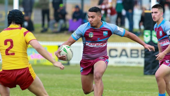 Lipoi Hopoi takes on the Holy Cross defence. Picture: Justin Lloyd