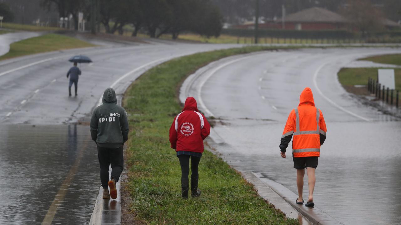 Vineyard residents survey the water level at Windsor Rd. Picture: John Grainger