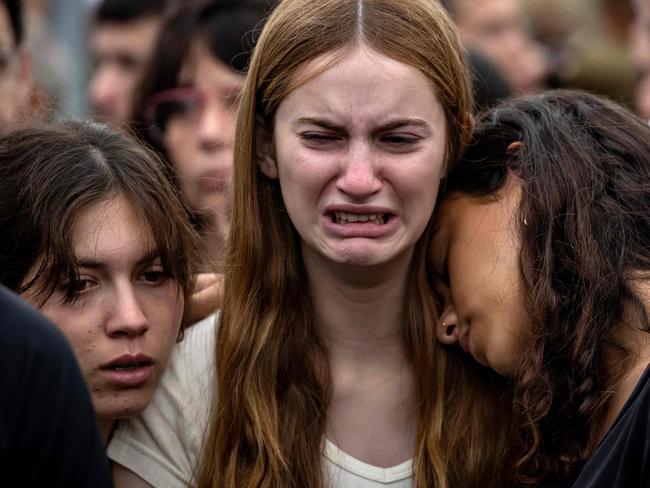 TOPSHOT - -- AFP PICTURES OF THE YEAR 2023 --  Relatives react during the funeral of an Israeli soldier on November 1, 2023, in a military cemetery in Jerusalem amid the ongoing battles between Israel and the Palestinian group Hamas.. Thousands of civilians, both Palestinians and Israelis, have died since October 7, 2023, after Palestinian Hamas militants based in the Gaza Strip entered southern Israel in an unprecedented attack triggering a war declared by Israel on Hamas with retaliatory bombings on Gaza. (Photo by FADEL SENNA / AFP) / AFP PICTURES OF THE YEAR 2023