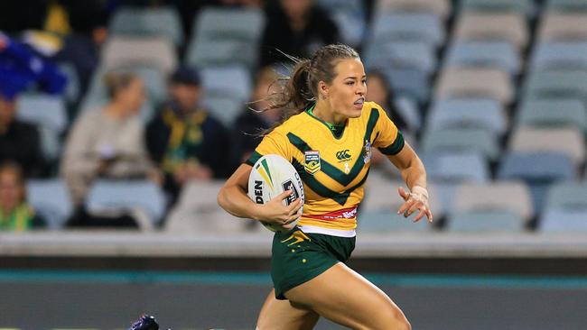 Isabelle Kelly of the Jillaroos races over to score a try during the Australian Jillaroos v NZ Kiwi Ferns match at GIO Stadium, Canberra. Pic: Mark Evans