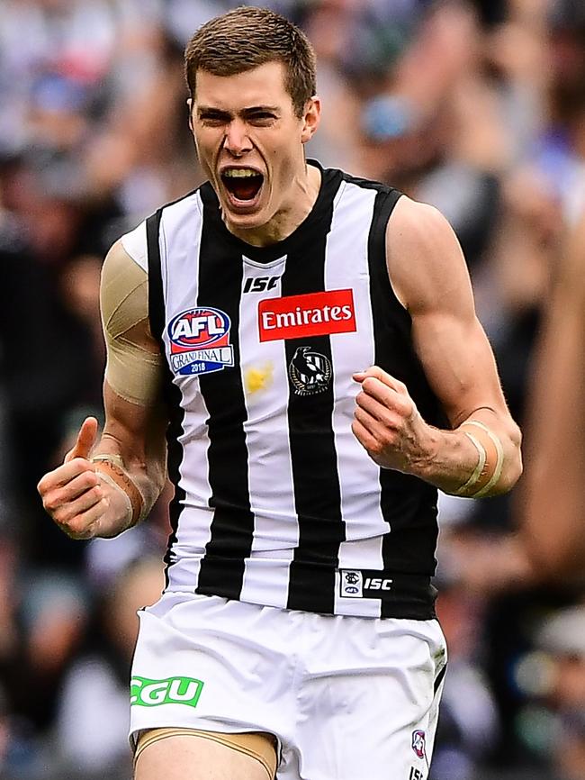 Mason Cox celebrates a goal in the Grand Final.