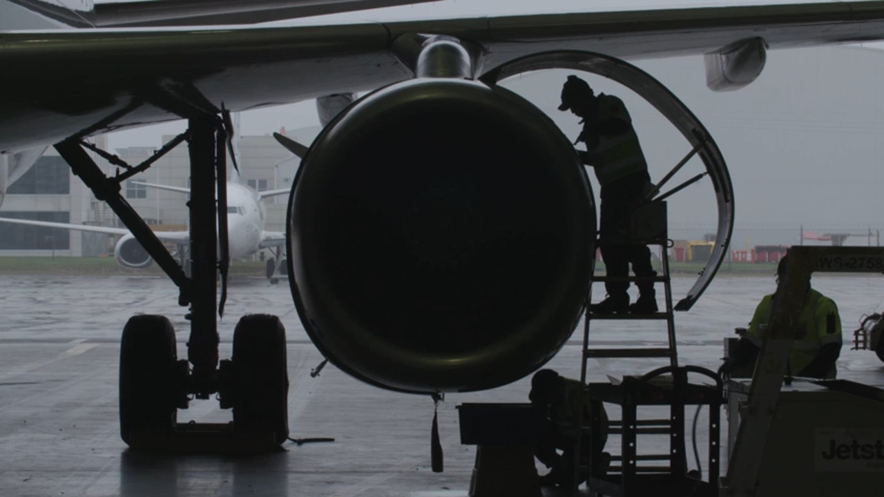 Engineers change the engine of a A320 at Jetstar’s engineering hangar in Melbourne. Picture: Jetstar