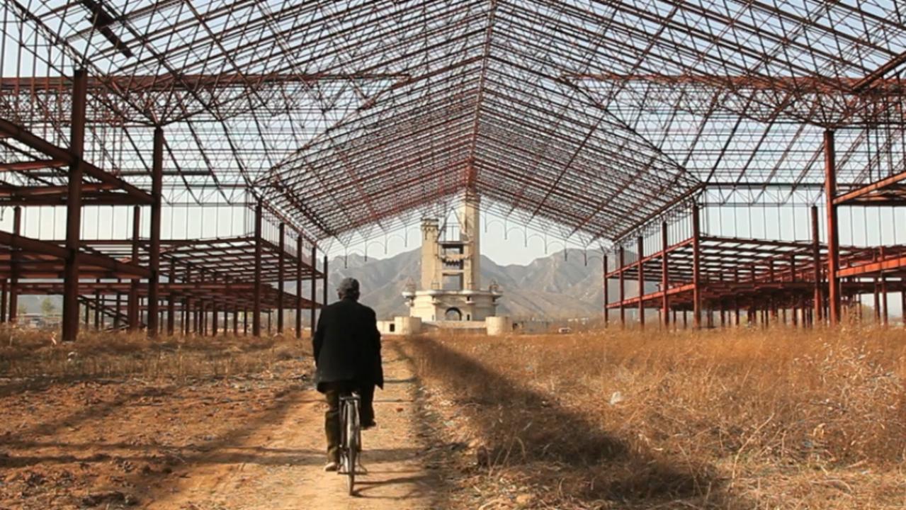 A bike rider approaches the abandoned Wonderland in Beijing China. Picture: Joe Wolf/Flickr