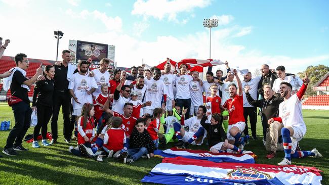 Raiders players and officials celebrate their State League One grand final win. PICTURE: ADAM BUTLER