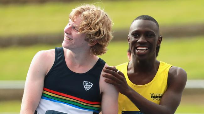 Calem Brown of Picton High School and Rashid Kabba of Westfields Sports High School embraces after the 16 years Boy 110m Hurdles finals at the NSW All Schools Championship. Pic: Jeremy Ng