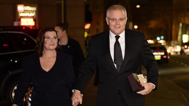 Prime Minister Scott Morrison and wife Jenny Morrison arrive for John Howard's birthday at The Australian Club in 2019 (AAP Image/Bianca De Marchi)