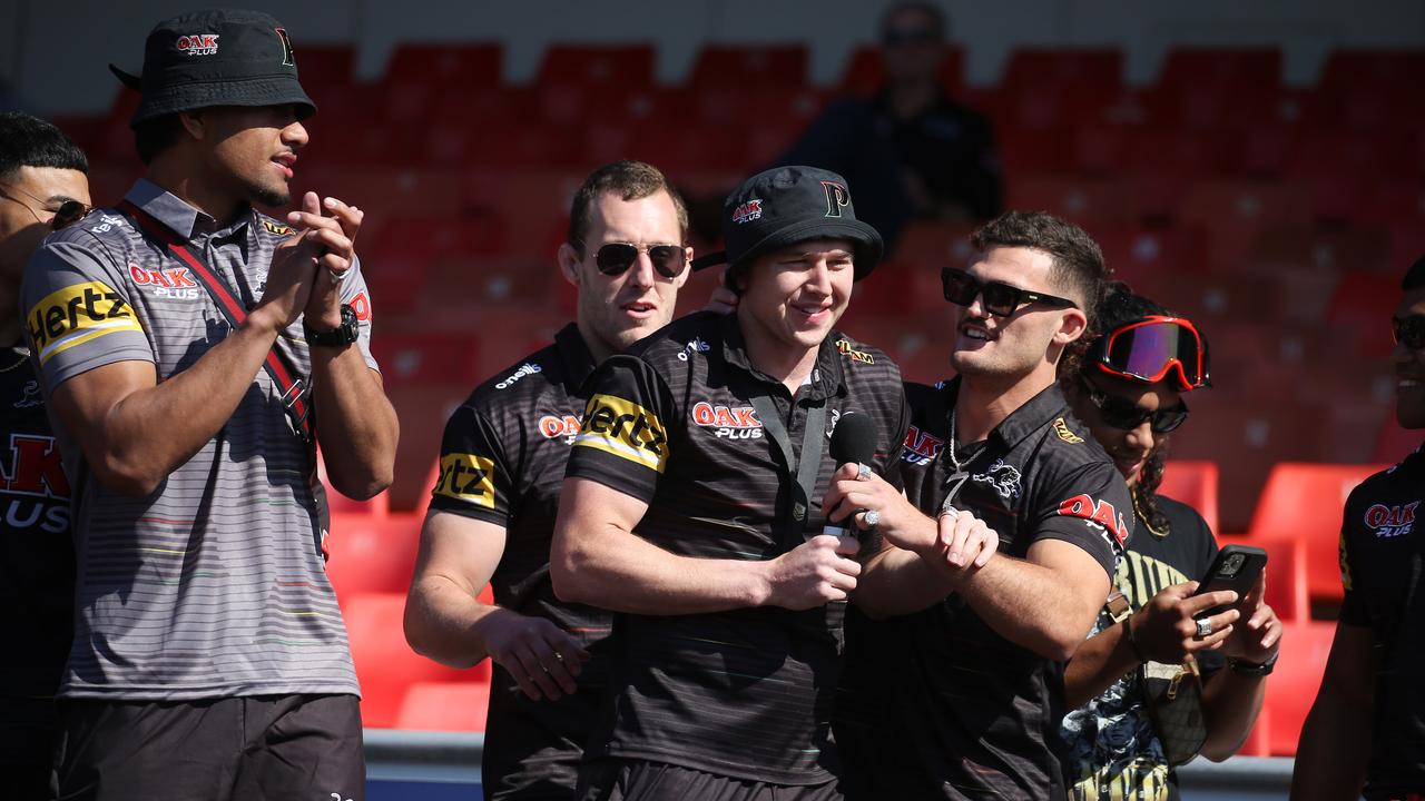 Dylan Edwards (centre) mobbed by teammates at Penrith’s grand final fan day. Picture: John Feder