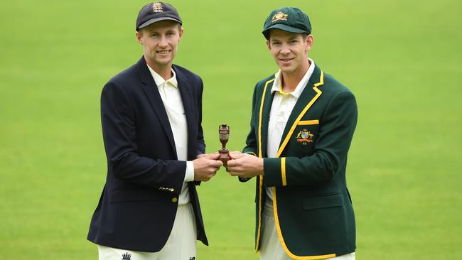 England captain Joe Root, left, and Australia captain Tim Paine pictured holding the urn ahead of the First Ashes Test Match. Picture: Stu Forster/Getty