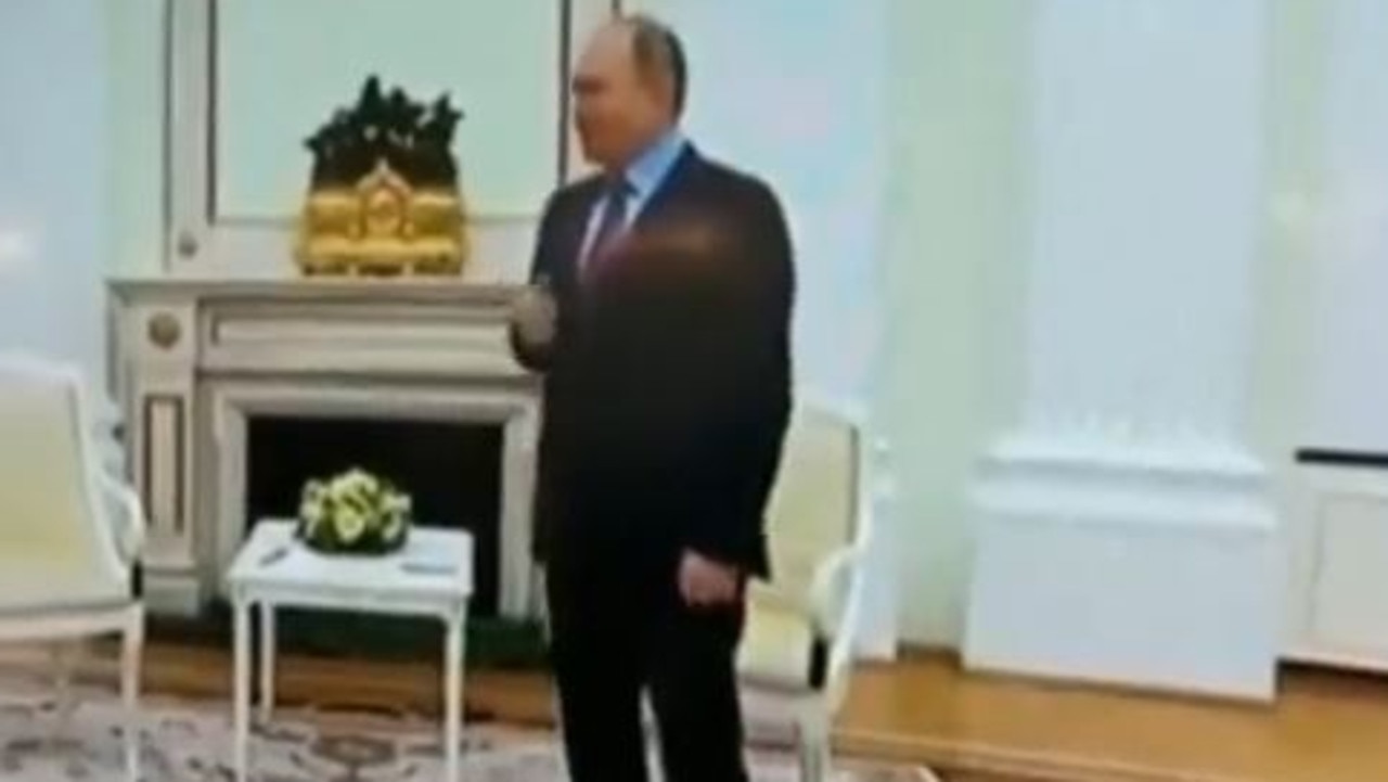 The Russian tyrant looks unsteady as he greets a visitor in a resurfaced clip. Picture: Twitter/Visegrád 24