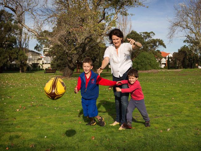 Marie Walters and her two boys Bryce, 4, and Jack, 6. Marie is hoping that open space will be in the plans for the promised new "vertical" South Melbourne primary school. Picture: Sarah Matray