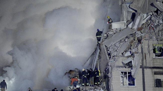 Rescuers works on a residential building destroyed after a missile strike, in Dnipro on January 14. Picture: AFP