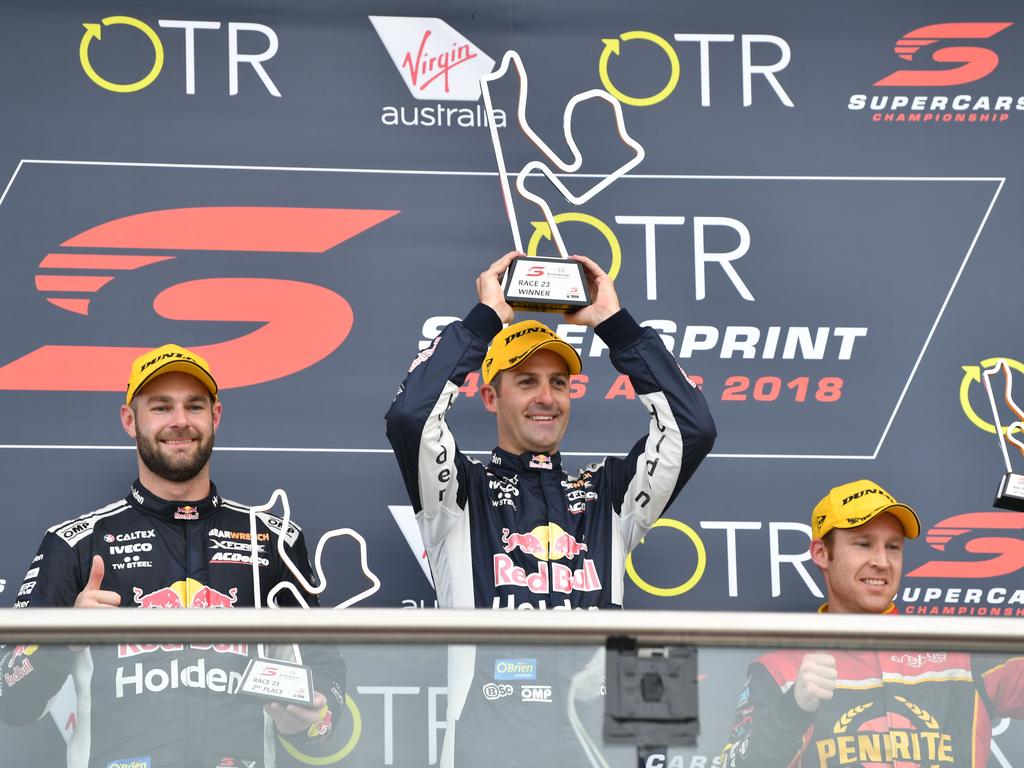 Second-placed getter Shane van Gisbergen, winner Jamie Whincup, and third-placed David Reynolds on the podium after Race Two on Sunday. Picture: AAP Image/David Mariuz