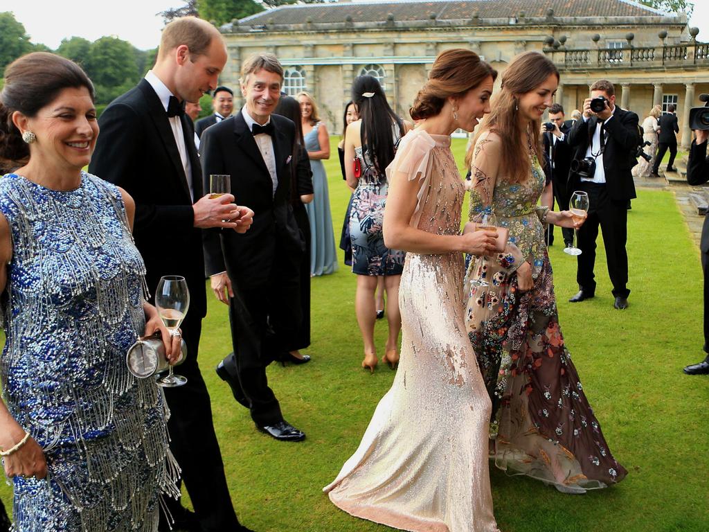 The Duke and Duchess of Cambridge walk alongside Hanbury and her husband at a past gala dinner at Houghton Hall in Norfolk.