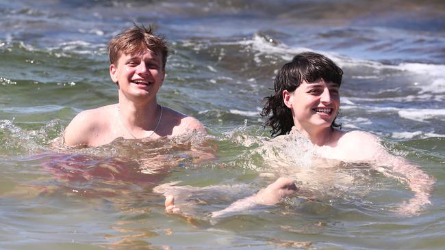 Sydney Schoolies Fred Williamson and Rory Jid relax at Clarkes Beach in Byron Bay. Photograph: Jason O'Brien