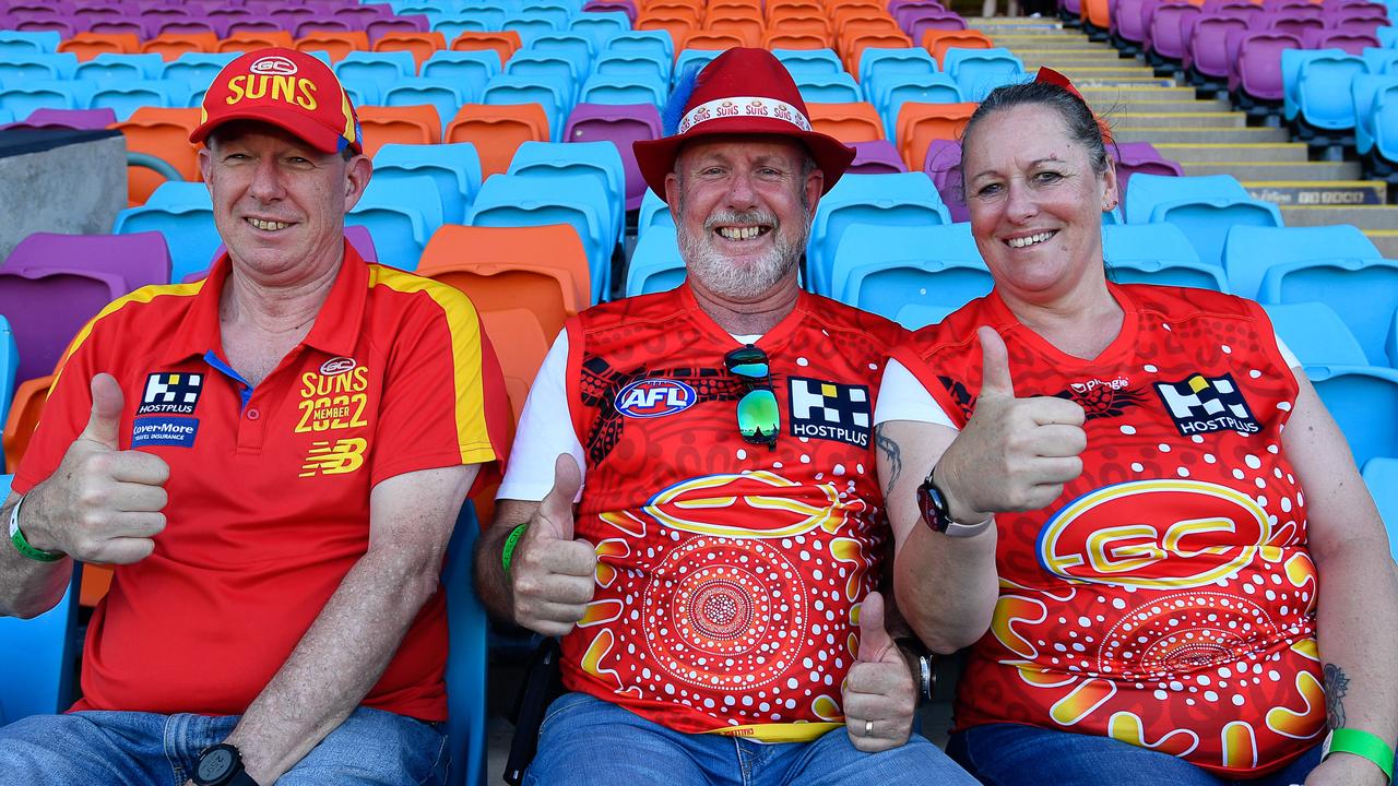 Andrew Powell, Clive Barnard and Kim Barnard got in super early to show their support for the Gold Coast Suns. Picture: Pema Tamang Pakhrin