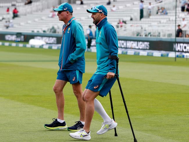 Nathan Lyon on crutches after suffering a calf injury. Picture: Ian Kington/AFP.