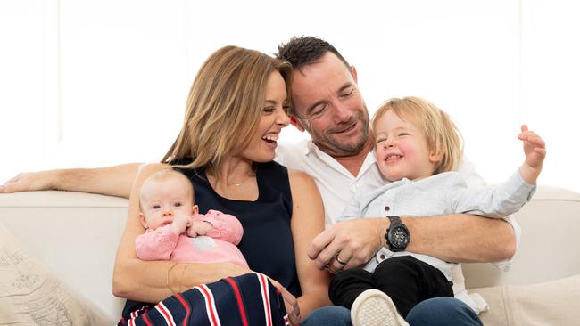 Allison Langdon, Mike Willesee pose for a photo with their children, baby Scout and Mack, 2 at their home in Bronte. Allison is an ambassador for RU OK and is doing the Anytime Fitness treadmill challenge to raise funds. AAP IMAGE/MONIQUE HARMER