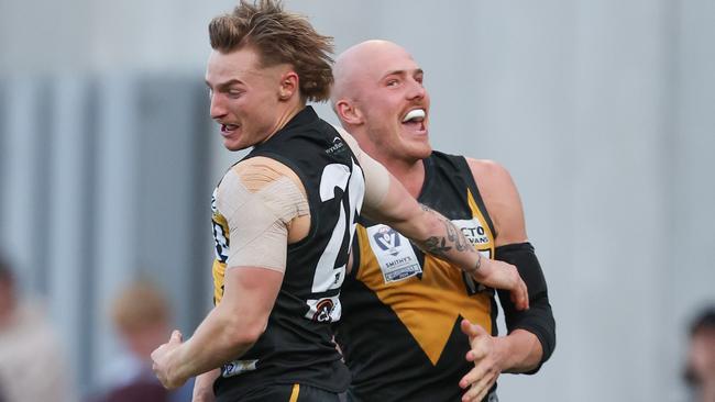 MELBOURNE, AUSTRALIA - SEPTEMBER 22: Aidan Johnson and Jay Dahlhaus of the Tigers celebrate a goal during the 2024 VFL Grand Final match between Werribee and the Southport Sharks at IKON Park on September 22, 2024 in Melbourne, Australia. (Photo by Rob Lawson/AFL Photos via Getty Images)