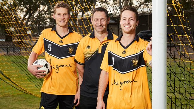 Tea Tree Gully City players Liam Crook and Rhys Devlin, with chairman Damien Kuypers, are set for the club’s FFA Cup debut. Picture: Matt Loxton