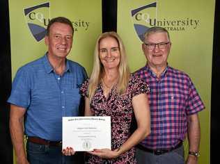 NURSING PRIZE: CQUni Nursing student Margaret Neill-Ballantine receives a bursary from Iwasaki Foundation Bursary Chairman Chris Kennard (right) and Foundation Committee Member Bob Pleash (left). Picture: Contributed