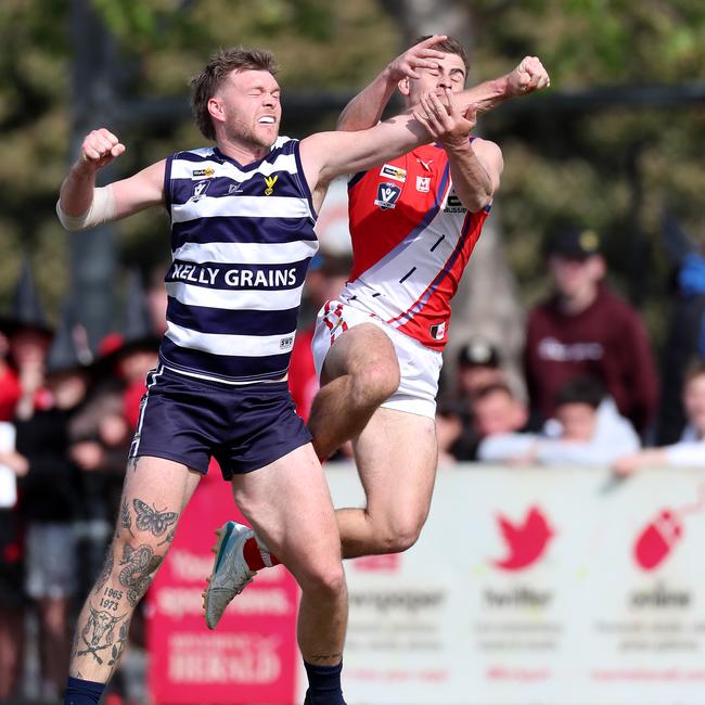 Congupna’s Kyle Mueller has his marking attempt spoiled by Finley’s Kyle Coates.