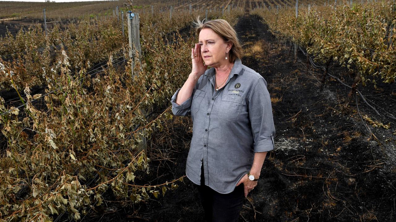 An emotional Barristers Block Winery owner Jan Siemelink-Allen in her burnt out vineyard at Woodside. Picture: Tricia Watkinson