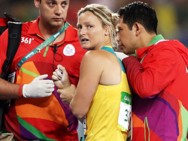 Kim Mickle is assisted by medical staff after her injury. (Photo by Cameron Spencer/Getty Images)