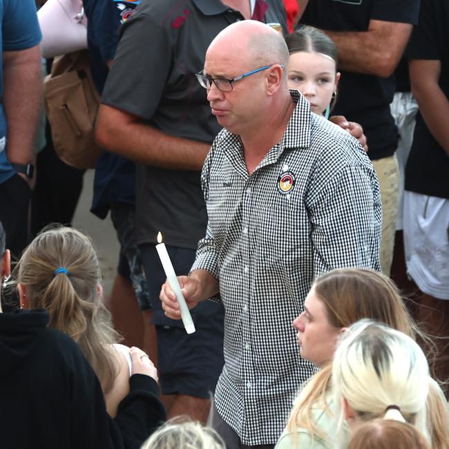 Steve Zmuda with a candle for his daughter Charlize at a vigil for her earlier this week. Picture: David Clark