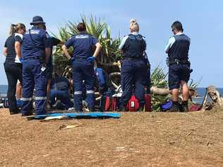 Emergency services at the scene at Lennox Head, where a tree has fallen on a man. Picture: Mitchell Craig