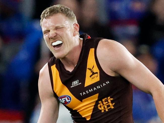 MELBOURNE, AUSTRALIA - MAY 05: James Sicily of the Hawks leaves the field with an injured shoulder during the 2024 AFL Round 08 match between the Western Bulldogs and the Hawthorn Hawks at Marvel Stadium on May 05, 2024 in Melbourne, Australia. (Photo by Dylan Burns/AFL Photos via Getty Images)