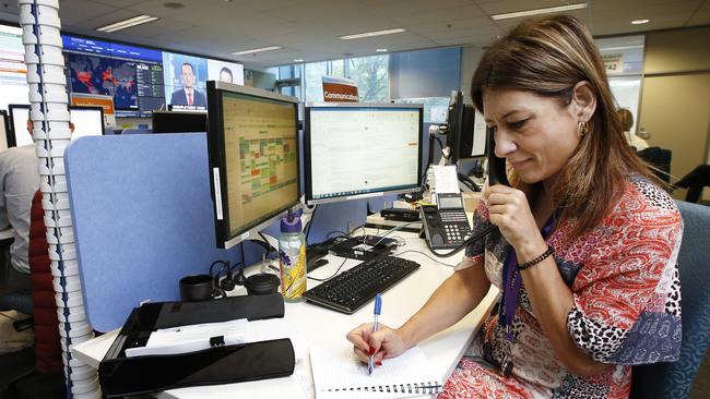 Lucia Losinno takes calls in the communications section of the DHHS COVID-19 control centre. Picture: David Caird