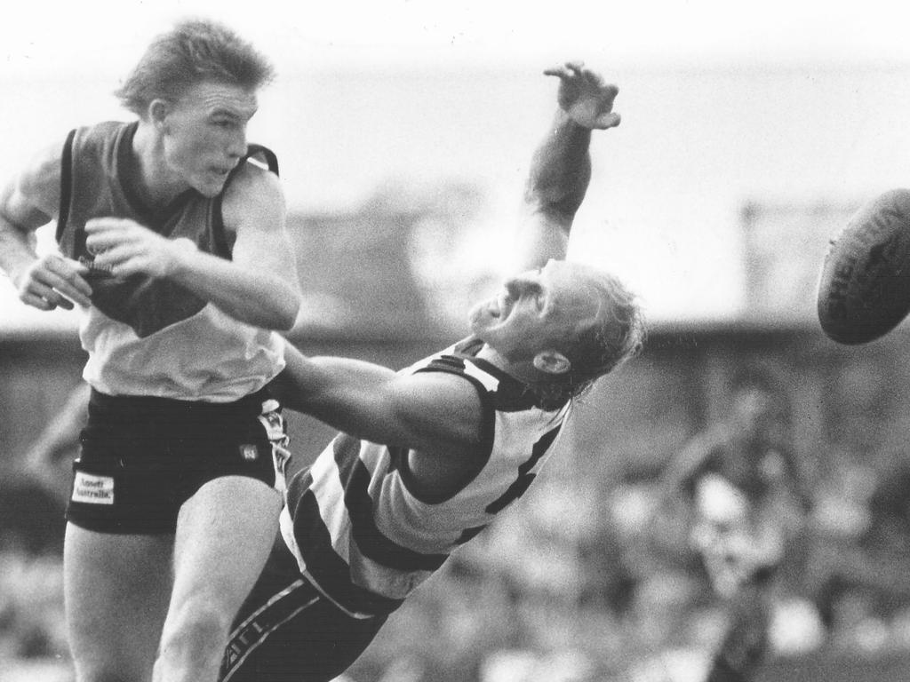 Nathan Buckley playing on the wing for the NTFL rep side against Geelong's Gary Ablett in the 1992 Australia Day clash at Football Park in Marrara.