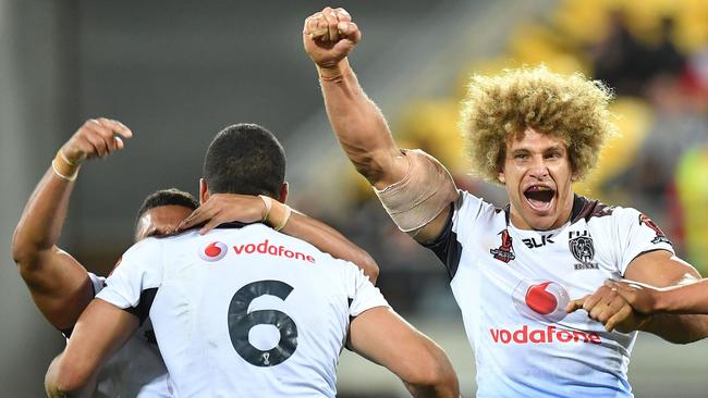 Fiji players celebrate their stunning win over New Zealand.