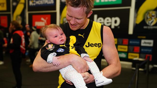 Jack Riewoldt of the Tigers with his daughter Poppy after the game. Picture: Scott Barbour/Getty Images