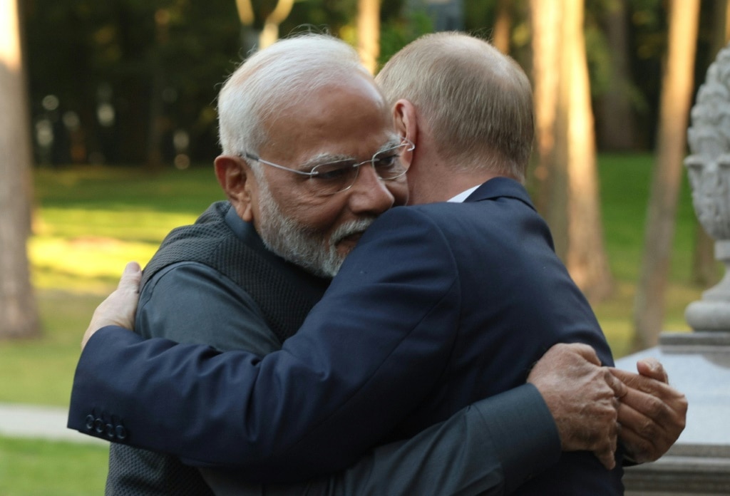 Indian Prime Minister Narendra Modi and Russian President Vladimir Putin embrace at the Novo-Ogaryovo state residence outside Moscow on Monday